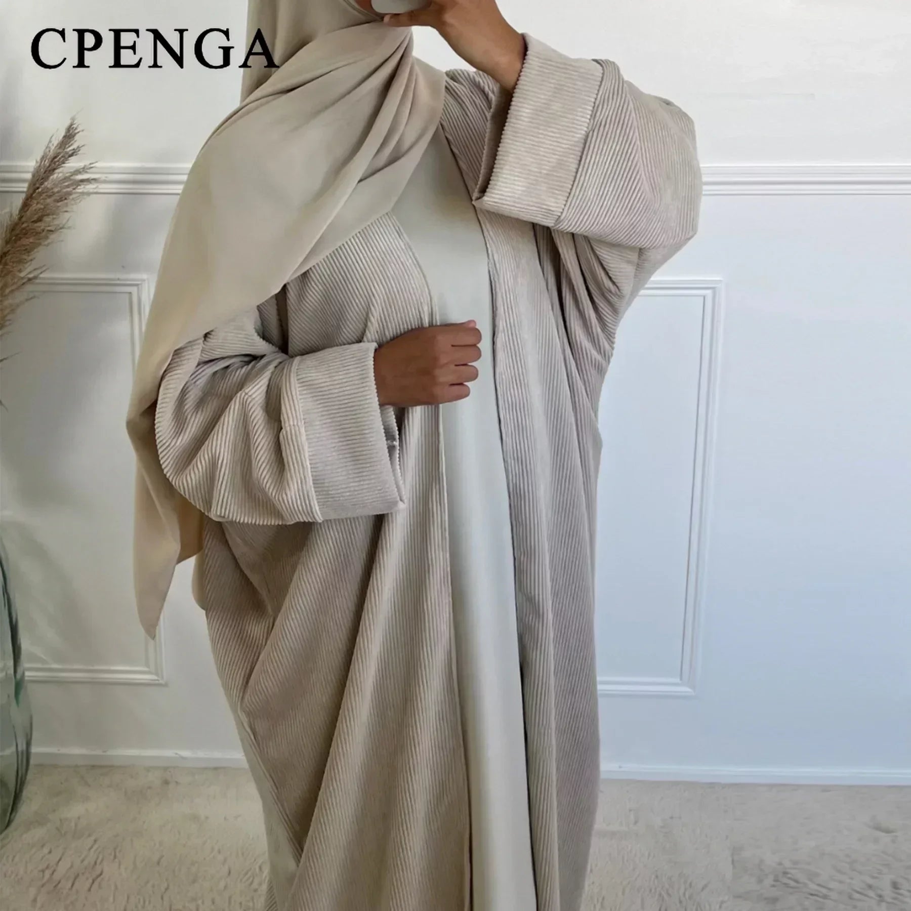 Elegant Corduroy Abaya featuring a chic design - ideal for modern modest wear.