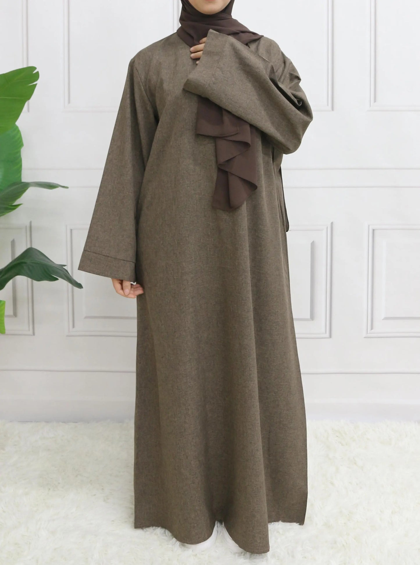 Elegant Modest Closed Plain Long Sleeve Abaya without hijab, featuring a stylish belt for a flattering silhouette.