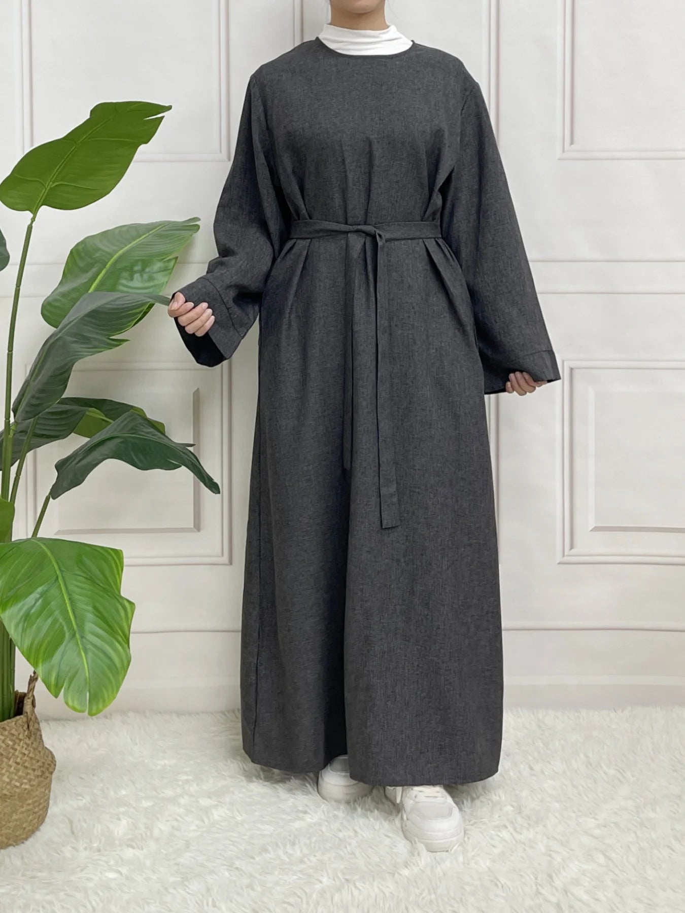 Premium Long Sleeve Abaya without hijab, offering a clean, minimal design and modest coverage with a chic belt detail.